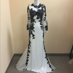 Long white and black gown with sleeves